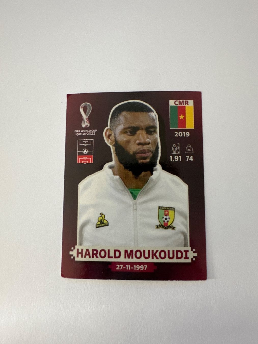 Panini FIFA WM 2022 Oryx - CMR 8 - Harold Moukoudi – Original-Zustandsfoto Vorderseite
