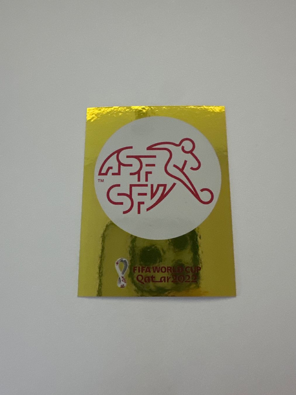 Panini FIFA WM 2022 Oryx - SUI 2 - Team Logo - Switzerland – Original-Zustandsfoto Vorderseite